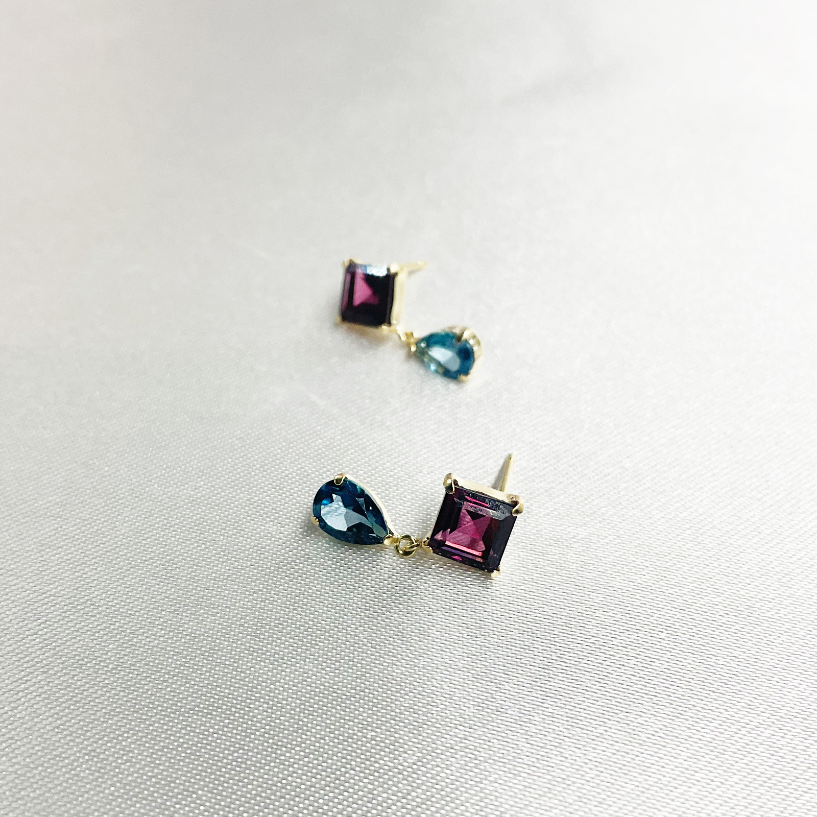 ジュエリーまつき / K18ガーネット/ロンドンブルートパーズピアス