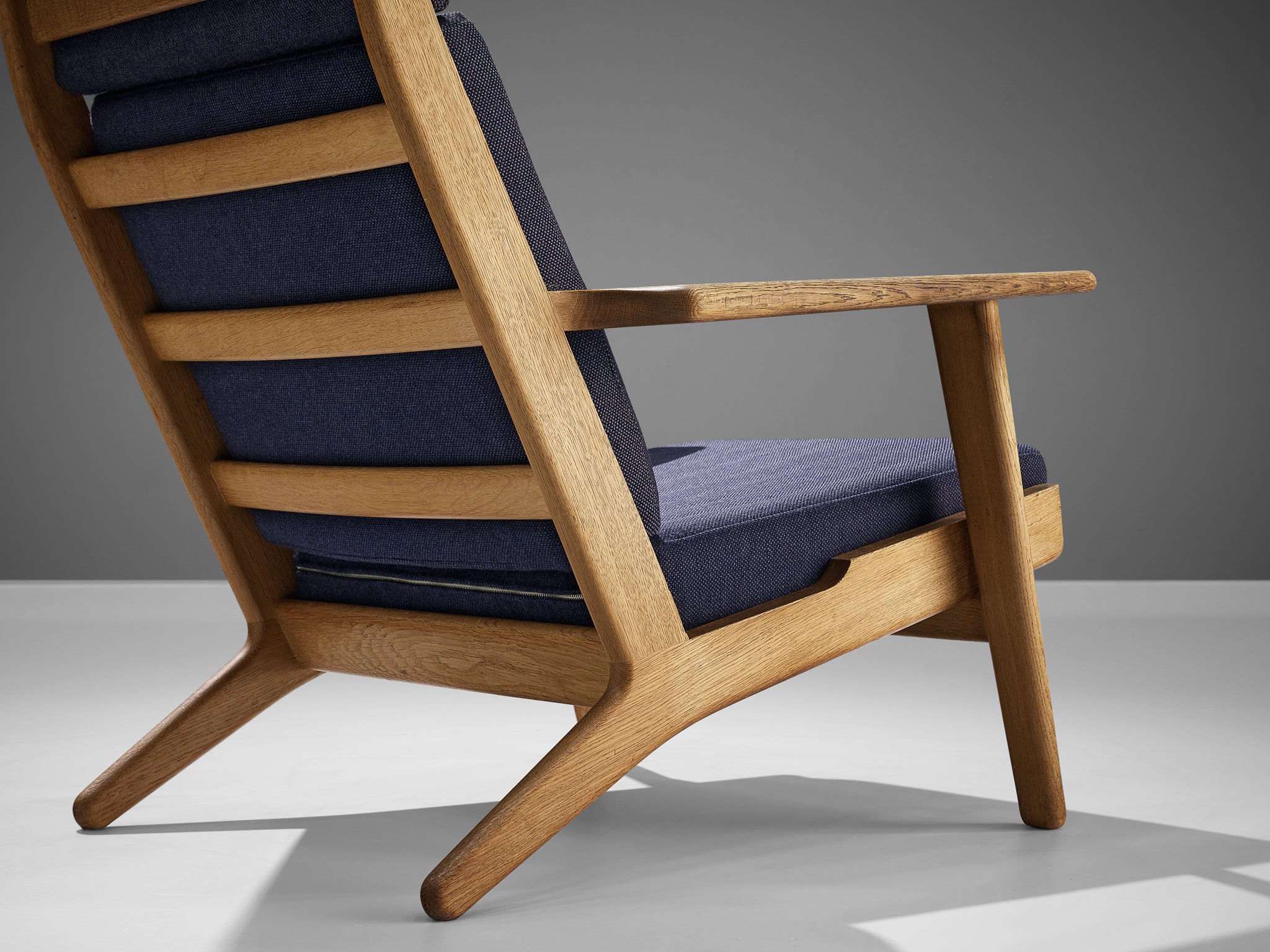 Hans J. Wegner for GETAMA Lounge Chair in Oak and Dark Blue Upholstery