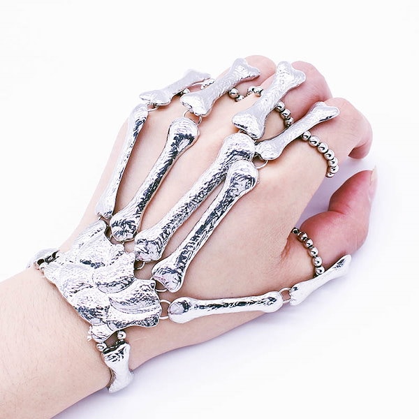 Qoo10] ドクロハンドアーマーリング 手首 ブレス