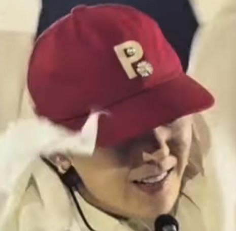 What red cap is he wearing during 