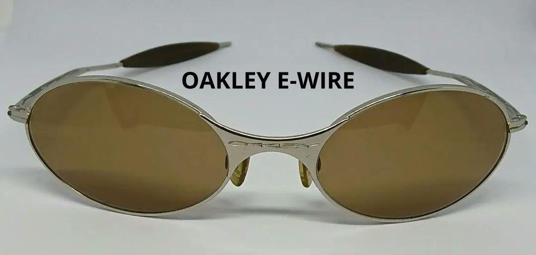 OAKLEY e-wire ['90s] Color: Gold (frame) x Brown (lens