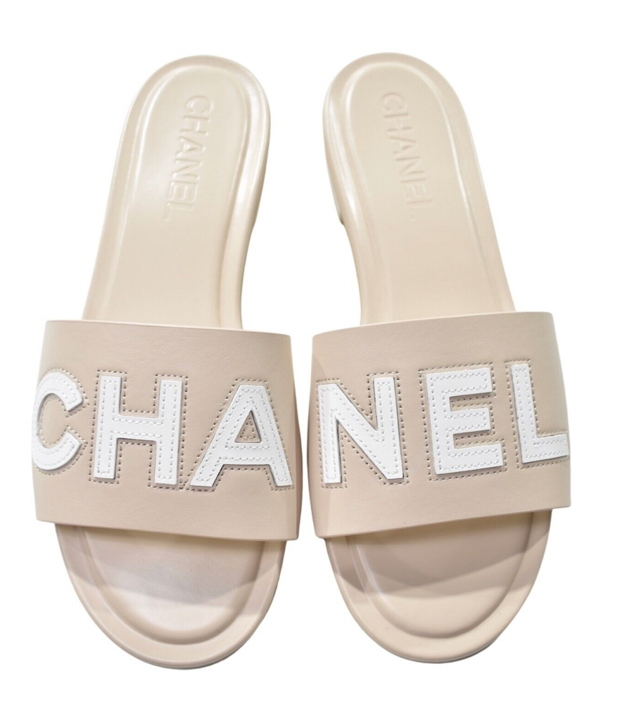 Chanel 23P Ivory White Leather CC Logo Letter Mules Slide Slip