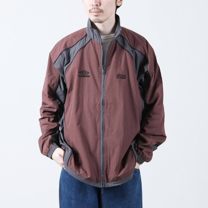 SEDAN ALL-PURPOSE (セダンオールパーパス) UMBRO Woven Track Jacket