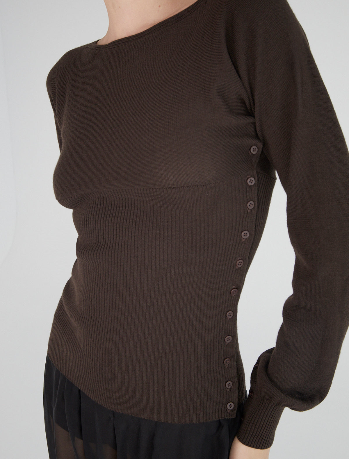 FA-Flat cross-shaped top with buttons along the sides and sleeves