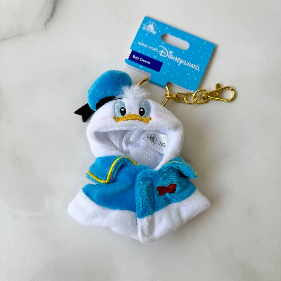 ドナルド ポンチョ キーチェーン 香港ディズニー - メルカリ
