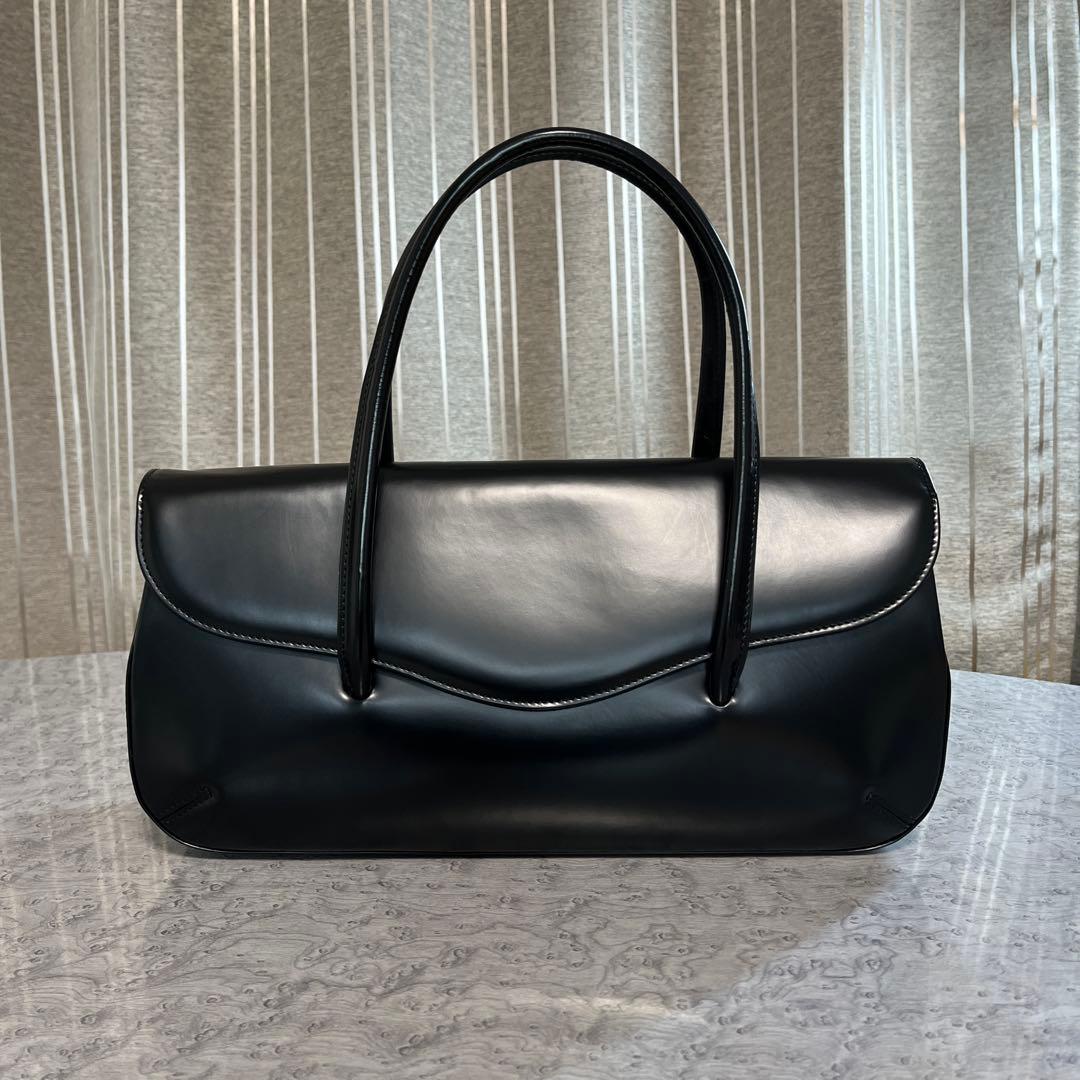 コムデギャルソン 青山オリジナルステアバック 横長 黒 - メルカリ