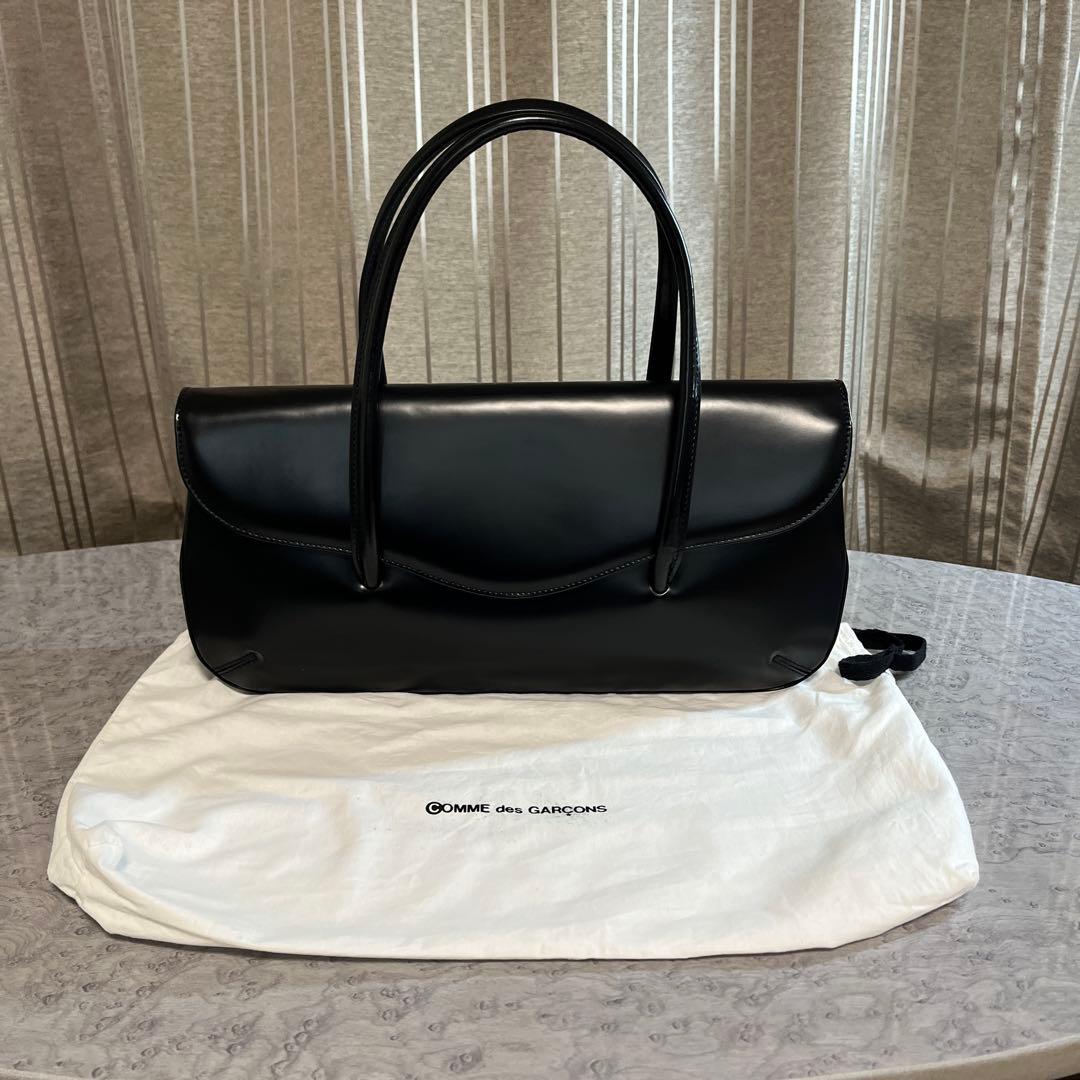コムデギャルソン 青山オリジナルステアバック 横長 黒 - メルカリ