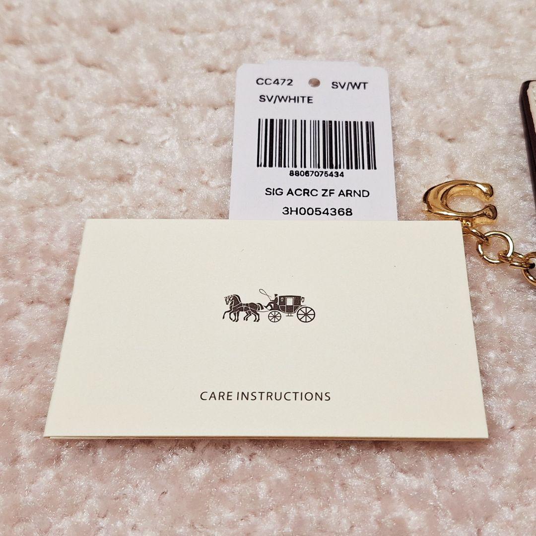 新品未使用☆ COACH 猫イラスト 二つ折り財布 クリーム色 ☆ コーチ