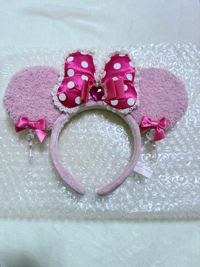 東京ディズニーリゾート ピンクイヤリングカチューシャ - メルカリ
