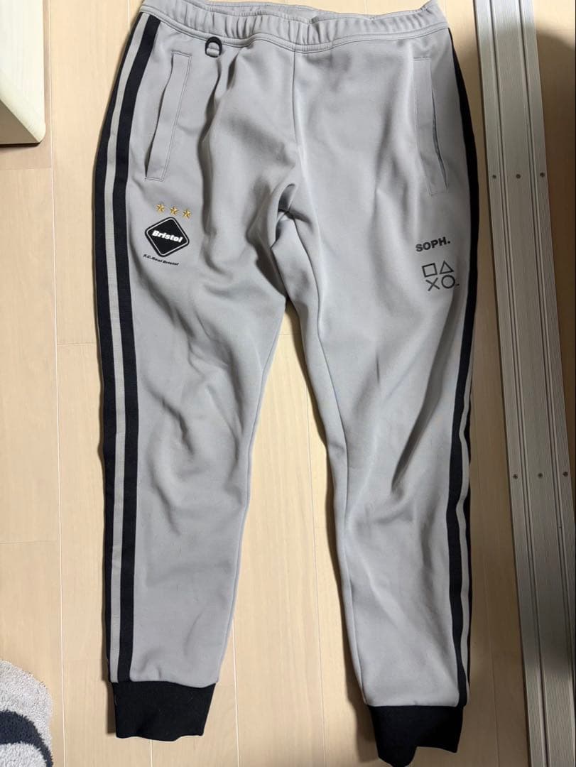 ASEBristol トラックパンツ プレイステーションコラボ オーバーサイズドパイピング トラックパンツ PlayStation