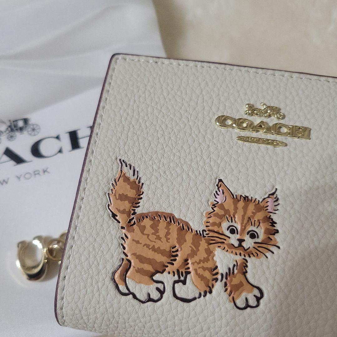 COACH コーチ 猫イラスト 二つ折り財布 ネコ アウトレット - メルカリ