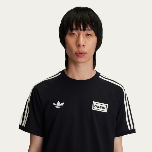 adidas Originals × Oasis ツアースリーストライプス Tシャツ