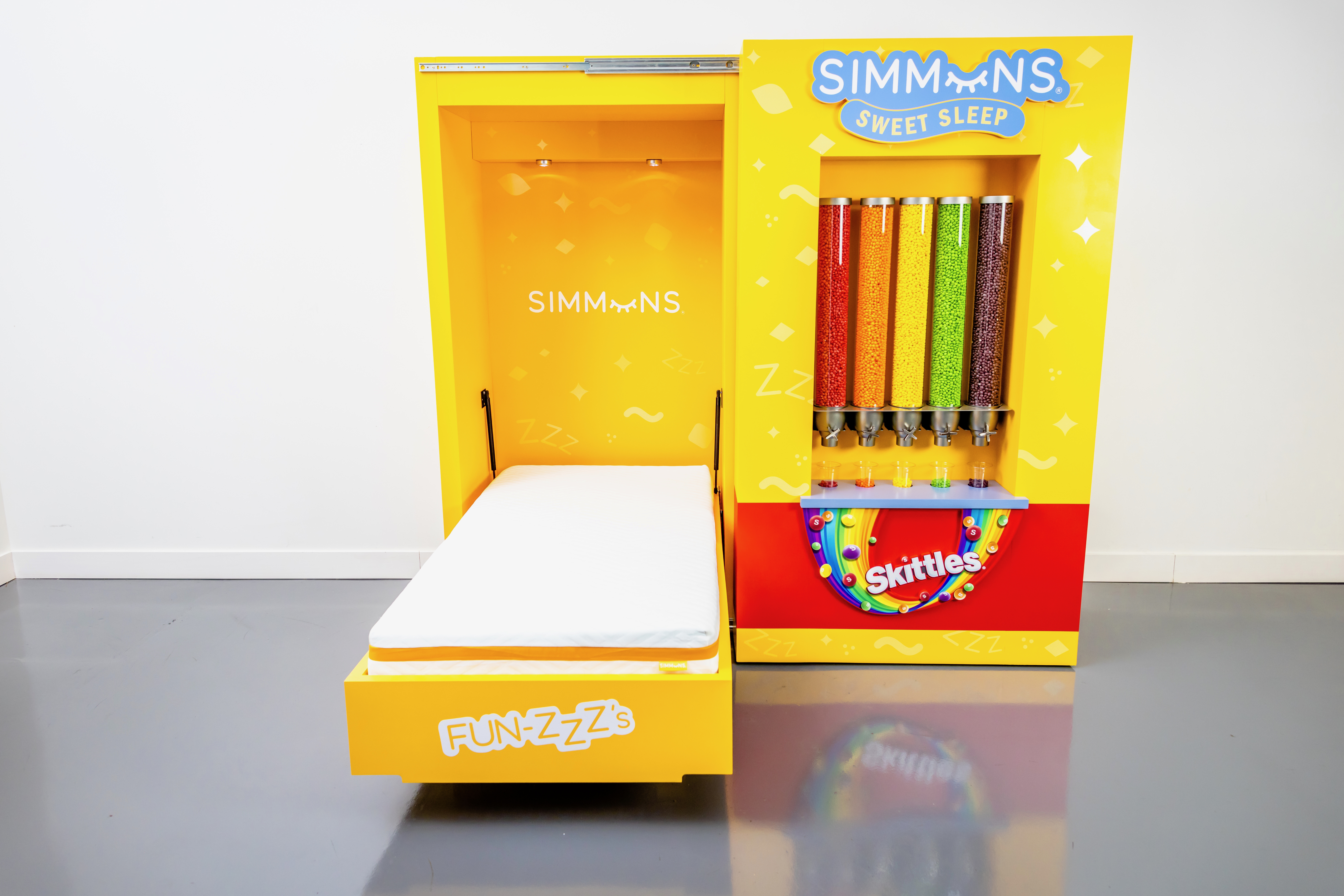 You can buy this Simmons bed that dispenses Skittles for $1.50